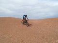 Mountain biker riding downhill the famous Slickrock trail, Moab, USA