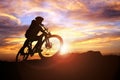 Mountain biker silhouette in action against the sunset concept f Royalty Free Stock Photo