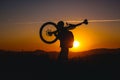 Mountain biker silhouette in sunset