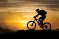 Mountain biker symbolizing triumph, overcoming challenges, sunset silhouette