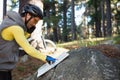 Mountain biker talking mobile phone while looking at map