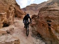 Mountain biker in the Timna valley mountains gorge Royalty Free Stock Photo