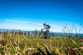 Mountain biker on top of a hill climb Royalty Free Stock Photo