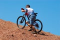 Mountain biker uphill Royalty Free Stock Photo