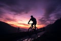 Mountain bikers enjoy a twilight ride through scenic, hilly landscapes Royalty Free Stock Photo