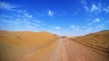 Mountain bikers riding the bike in a desert road Royalty Free Stock Photo