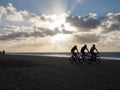 Mountain bikers taking part in the beach race Egmond-Pier-Egmond ride along the sea shore