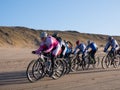 Mountain bikers taking part in the beach race Egmond-Pier-Egmond ride along the sea shore