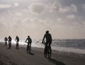 Mountain bikers taking part in the beach race Egmond-Pier-Egmond ride along the sea shore Royalty Free Stock Photo