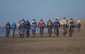 Mountain bikers taking part in the beach race Egmond-Pier-Egmond ride along the sea shore