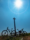 Mountain bikes at wooden tourist sign on mountain trail to mountain Paganella Royalty Free Stock Photo