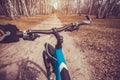 Mountain biking down hill descending fast on bicycle. Royalty Free Stock Photo