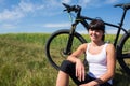 Mountain biking happy sportive girl relax in meadows sunny countryside Royalty Free Stock Photo