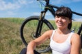 Mountain biking happy sportive girl relax in meadows sunny countryside Royalty Free Stock Photo