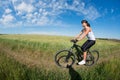 Mountain biking happy sportive girl relax in meadows sunny countryside Royalty Free Stock Photo