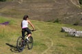 Mountain biking happy sportive girl relax in meadows sunny countryside Royalty Free Stock Photo