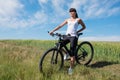 Mountain biking happy sportive girl relax in meadows sunny countryside Royalty Free Stock Photo