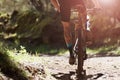 Mountain biking man riding on bike in summer mountains forest Royalty Free Stock Photo