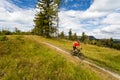 Mountain biking man riding in woods and mountains