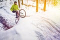 Mountain biking in snowy forest