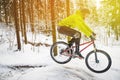 Mountain biking in snowy forest