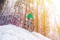 Mountain biking in snowy forest