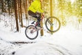 Mountain biking in snowy forest