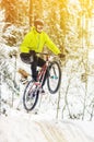 Mountain biking in snowy forest