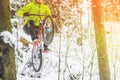 Mountain biking in snowy forest