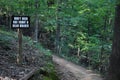 Mountain Biking Trail Sign along Path Royalty Free Stock Photo