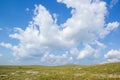 Mountain Blue Sky with White Clouds above Green Hills Field