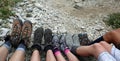 Mountain boots of the five-person family rests after the hike on Royalty Free Stock Photo