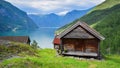 Mountain cabin in fjord lake landscape