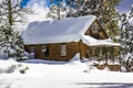 Mountain cabin with snow covered roof Royalty Free Stock Photo