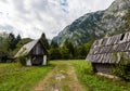 Mountain cabins in the region of Ukanc near the Lake Bohinj in the Triglav National Park in Slovenia on summer day with clouds Royalty Free Stock Photo