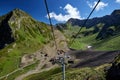 Mountain cableway stretching down over beautiful early autumn mountain landscape.