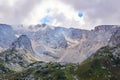 Mountain cirque bowl-shaped valley with melting glaciers and alpine meadows in the foreground; Mount Fisht, Caucasus Royalty Free Stock Photo