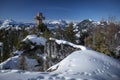 Mountain cliff Buchensteinwand at Wilder Kaiser with viewpoint and sightseeing spot Jakobskreuz in winter with snow, Fieberbrunn