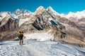 Mountain Climber ascending high Altitude Peak walking on Snow terrain