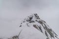 Mountain climber climbing the snow covered Alps in Mont Blanc Massif Royalty Free Stock Photo