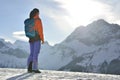 Mountain climber climbing at a snowy ridge Royalty Free Stock Photo