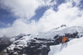 Mountain Climber Sitting On Snowy Peak