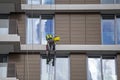 Mountain climber washes windows 2 Royalty Free Stock Photo