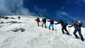 Mountain climbers climbing on northern glacier of Mount Damavand , Iran Royalty Free Stock Photo