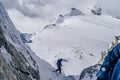 Mountain climbers climbing the snow covered Alps in Mont Blanc Massif Royalty Free Stock Photo