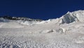 Mountain climbers on a steep glacier on their way to a high alpine summit early in the mornin Royalty Free Stock Photo