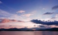 Mountain, cloud, gradient sky and ocean at sunset Royalty Free Stock Photo