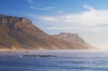 Mountain, clouds and natural island with sea, blue sky and calm landscape for travel location. Nature, fog and Royalty Free Stock Photo