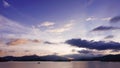 Mountain, cloudscape sky, boat on sea at sunset Royalty Free Stock Photo