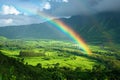 Mountain with colorful rainbow in cloudy sky over field. Nature landscape after storm. Spring morning